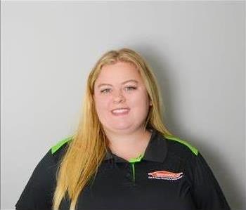 Tiffany Smith Project Manager at SERVPRO of East Cobb - female employee in front of white wall